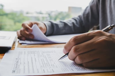 man-doing-his-taxes-AS-216934238
